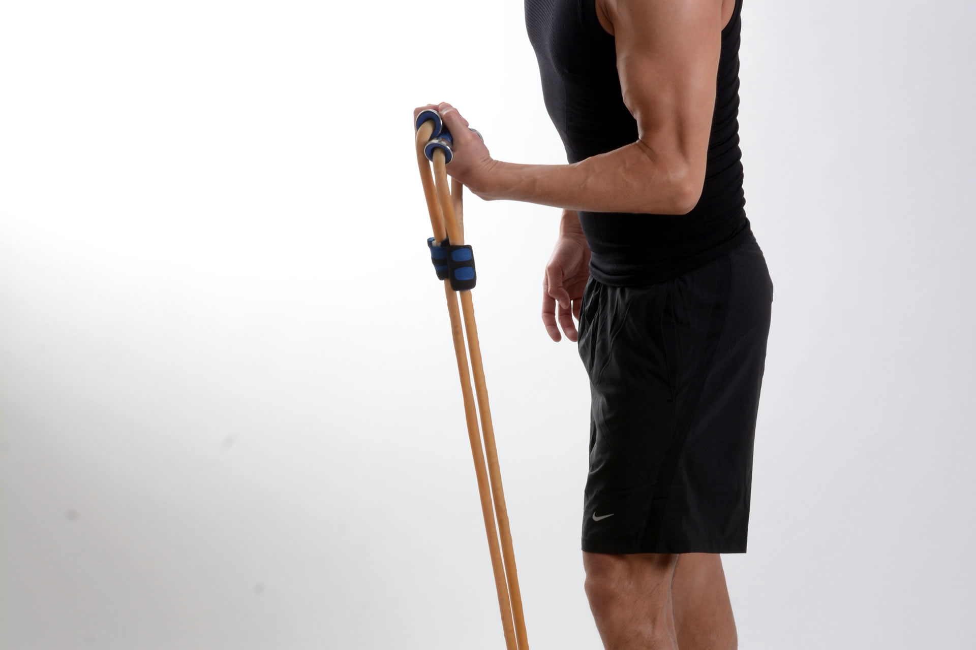 man exercising with resistance bands